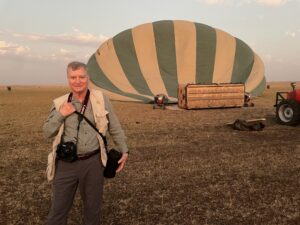 A man standing in front of an air balloon.